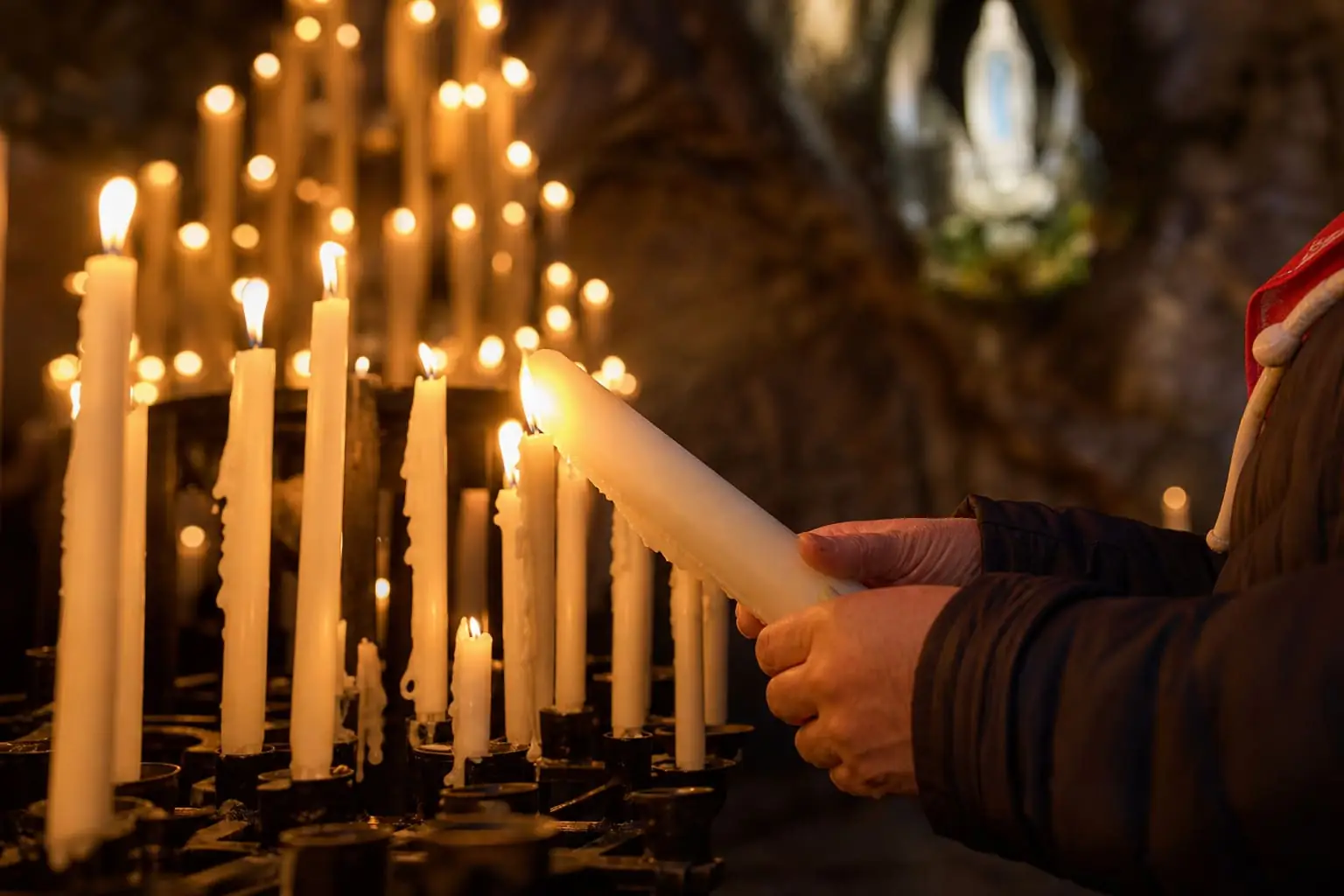 Lighting a Candle at the Grotto